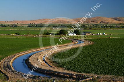 Farmland and irrigation canal near Vale, Oregon, USA.