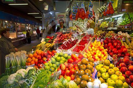Produce vendor at the Mercado de al Ribera along the Nervion River at Bilbao, Biscay, Spain.