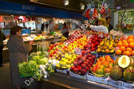 Produce vendor at the Mercado de al Ribera along the Nervion River at Bilbao, Biscay, Spain.
