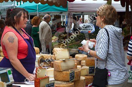 American tourist purchasing cheese at a Basque market at Saint-Jean-de-Luz in the Basque province of Labourd, southwestern France.