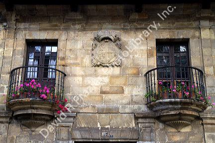 Coat of arms carved in a stone wall at Santillana del Mar, Cantabria, Spain.