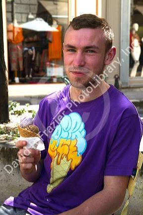 French man eating an ice cream cone wearing a matching t-shirt at Angouleme in southwestern France.