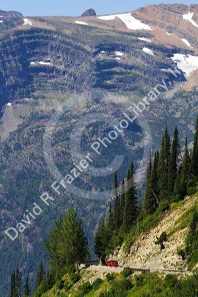 Red Jammer bus on the Going-to-the-Sun Road in Glacier National Park, Montana, USA.