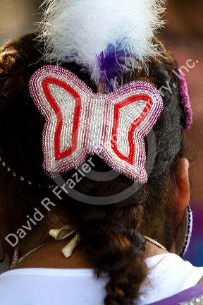 Blackfoot indian girl wearing a beaded butterfly hair barrette at the Blackfoot Arts and Heritage Festival at Waterton Park townsite in Waterton Lakes National Park, Alberta, Canada.