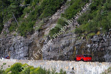 Red Jammer bus on the Going-to-the-Sun Road in Glacier National Park, Montana, USA.