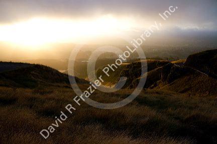 Mountain pass with fog at sunset near Hamilton in the Waikato Region, North Island, New Zealand.