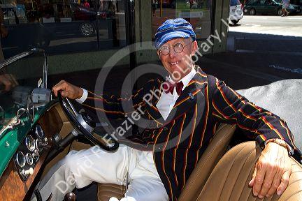 Man sits in his 1930's vintage car during the Tremains Art Deco Weekend  at Napier in the Hawke's Bay Region, North Island, New Zealand.