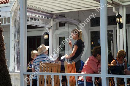 Patio dining at a restaurant in the waterfront town of Russell on the Bay of Islands, North Island, New Zealand.