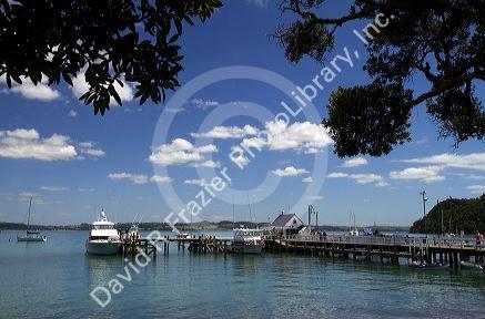Pier and boats docked in the waterfront town of Russell on the Bay of Islands, North Island, New Zealand.