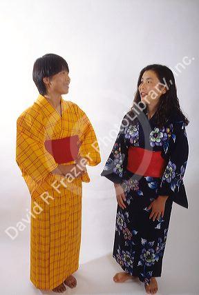 Japanese women wearing kimonos, native dress.  MR