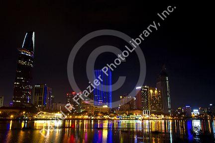 Night view of city lights reflected on the Saigon River in Ho Chi Minh City, Vietnam.