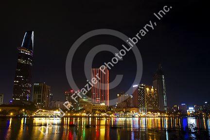 Night view of city lights reflected on the Saigon River in Ho Chi Minh City, Vietnam.