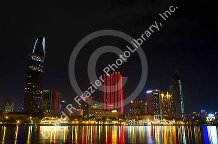 Night view of city lights reflected on the Saigon River in Ho Chi Minh City, Vietnam.
