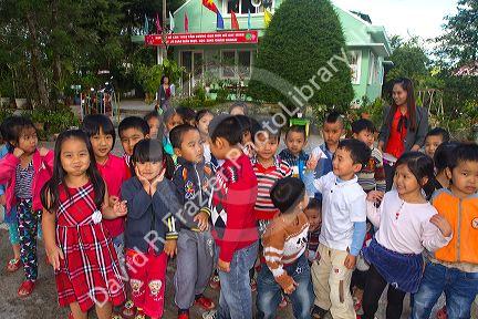 Young students outdoors at an elementary school in Da Lat, Vietnam.