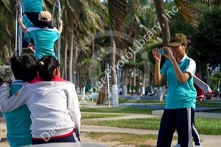 Vietnamese students taking photos in Nha Trang, Vietnam.