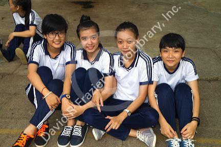 Vietnamese elementary school students wearing uniforms in Nha Trang, Vietnam.