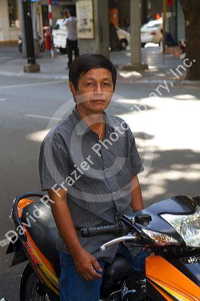 Mototaxi driver in Ho Chi Minh City, Vietnam.