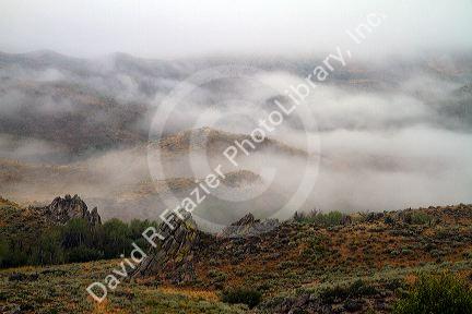 Fog blanketing the mountains along US 20 in Elmore County, Idaho, USA.