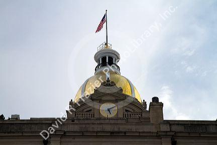 Gold dome and clock atop the City Hall in Savannah, Georgia, USA.