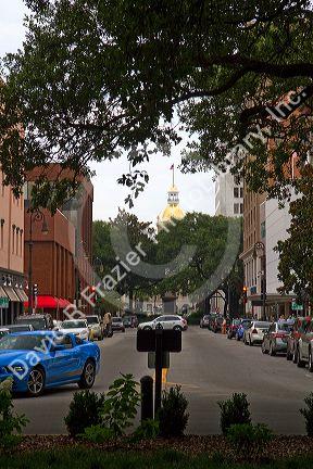 Gold dome and clock atop the City Hall seen from River Street in Savannah, Georgia, USA.