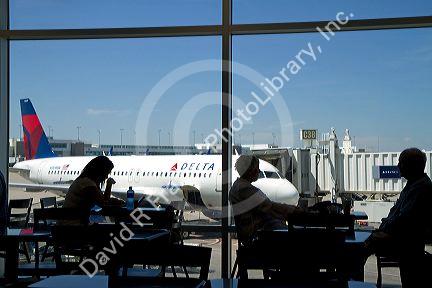 People eating at the food court area of the Denver International Airport, located in Denver, Colorado, USA.
