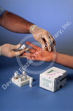 A person being tested for gunshot residue.  Evidence samples are collected and analyzed in a lab.