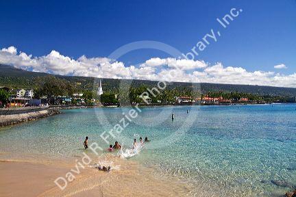 People swimming in the bay at Kailua-Kona on the Big Island of Hawaii, Hawaii, USA.