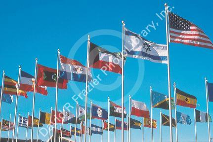 Flags of many nations flying on flag poles at church in Lansing, Michigan.