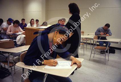 College student in a classroom taking a test.