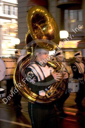 Sousaphone player in marching band in the Chinese New Year Parade, Chinatown, San Francisco, California.