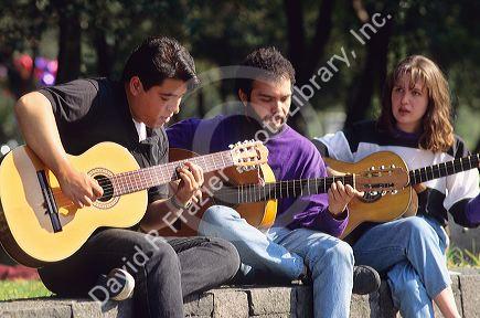Mexican students playing guitars.
