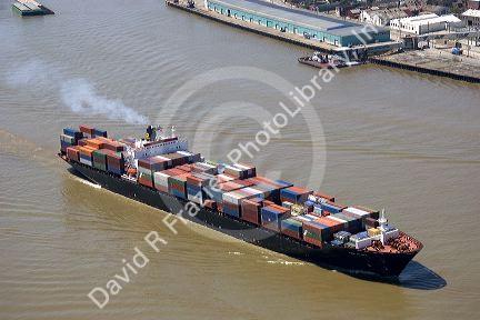 Container ship on the Mississippi River departing New Orleans, Louisiana.