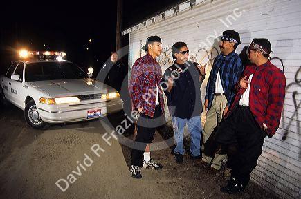 Hispanic gang members showing gang signs in Caldwell, Idaho.