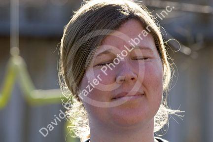 Portrait of a twenty eight year old woman looking sad.