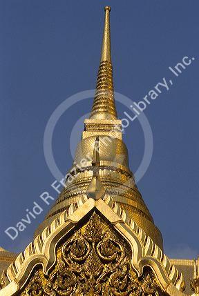 Gold leaf on A statue at The Grand Palace in Bangkok, Thailand.