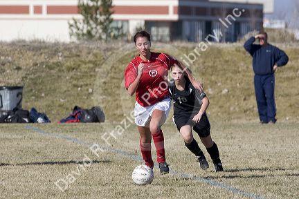 High school girls playing soccer.
