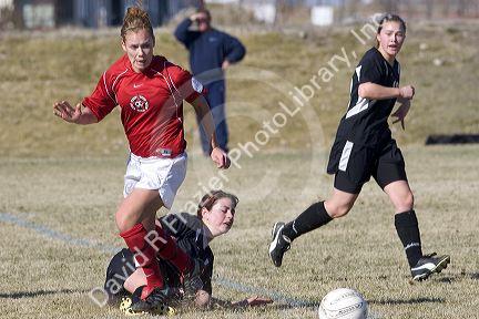 Girls playing soccer.