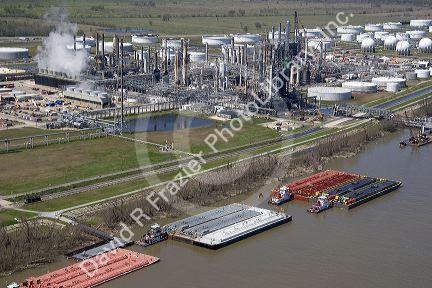 Aerial of refinery and tug boats along the Mississippi River near New Orleans, Louisiana.
