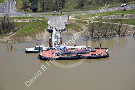 A ferry boat carries cars across the Mississippi River near New Orleans, Louisiana.