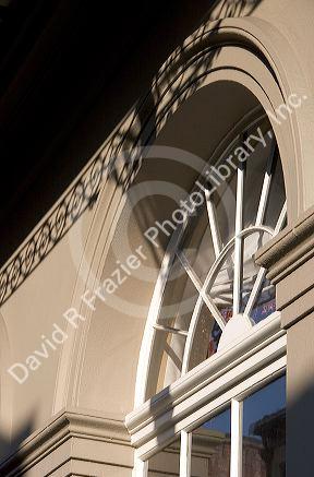 Shadows and wrought iron balconies in the French Quarter, New Orleans, Louisiana.