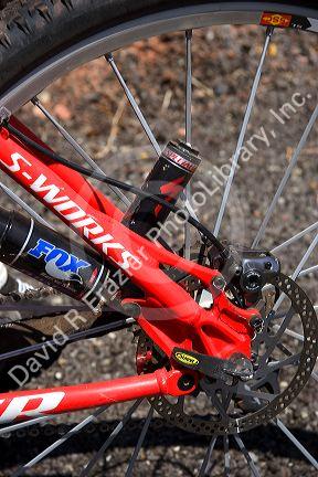 Mountain biking in the desert near Moab, Utah. Detail of disc brake and shock absorber.  (Model released)