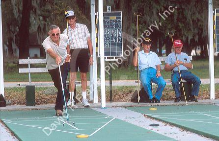 Seinor citizens play shuffleboard in Fort Meade, Florida.