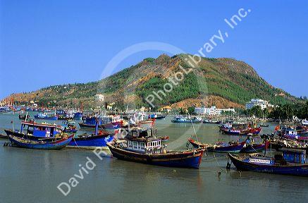 Fishing boats and China Hat Mountain in Vung Tau, Vietnam.