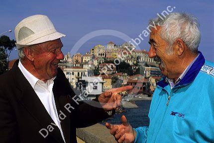 Italian men talking at Imperia, Italy.