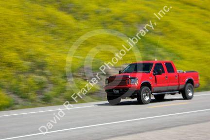 Pick up truck speeing down a highway in Wyoming.