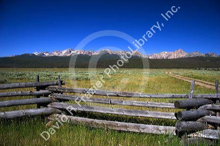 Sawtooth Mountains and rail fence at Stanley Basin, Idaho.