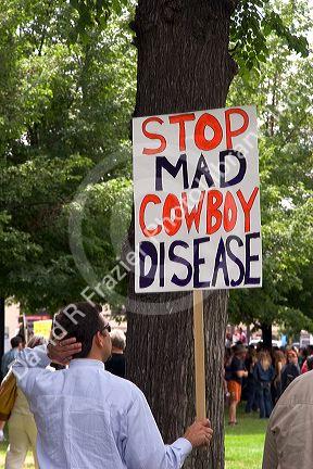 Man holding a sign at an Anti-war protest in Salt Lake City, Utah. 8/22/2005