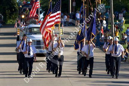 Veterans of Traer, Iowa march as honor guard in a parade for the Festival of the Spiral Steps.