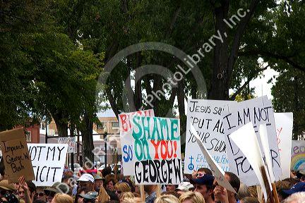 A crowd of people holding signs at an Anti-war protest in Salt Lake City, Utah. 8/22/2005