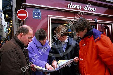Tourists looking at a map in Paris, France.